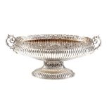 A European silver coloured twin handled oval pedestal bowl