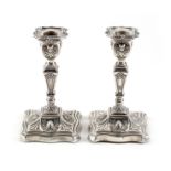 A pair of Victorian silver candlesticks by George Nathan & Ridley Hayes