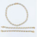 Parure composta da collier e doppio bracciale in oro giallo e bianco An 18 carat yellow and …