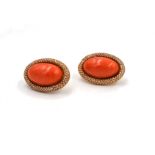 Orecchini in oro giallo, corallo cerasuolo e diamanti A pair of gold, coral and diamond earrings