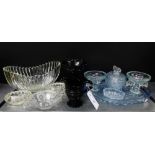 A quantity of moulded and pressed glass wares to include a dressing table set, oval salts, a good