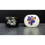 A Carlton ware globular match striker, together with another black glazed example with a chariot and