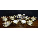 A 19th century Daniels porcelain tea service, pattern No.4058, with dark blue ground and yellow