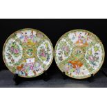 A pair of Chinese canton enamelled Famille rose plates, painted with figures, flowers and insects,