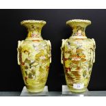 A pair of Japanese earthenware Satsuma style vases painted with figures and flowers, one a/f),