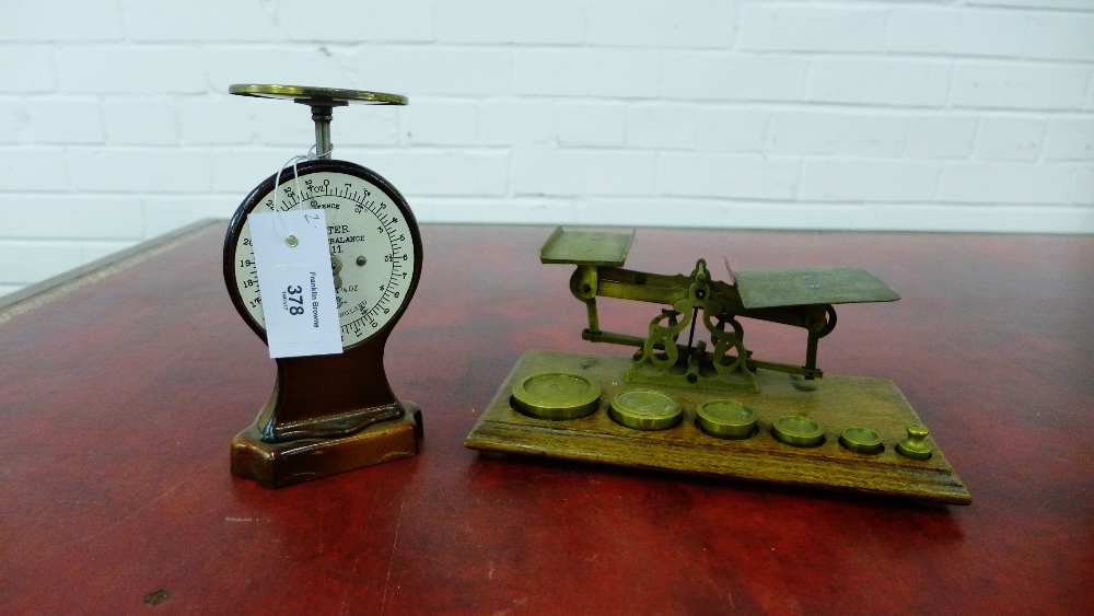 A set of brass and oak postal scales together with a Salter's Letter Balance, (2)