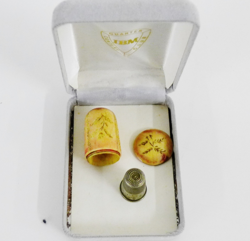 A stained ivory thimble case