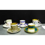 A collection of five porcelain coffee cans and saucers, to include, Arabia, Vista Alegre, Limoges