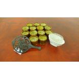 Kitchenalia to include a steel trivet, a ceramic jelly mould and a glass mould, together with