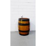 An oak and iron bound spirits barrels with chromed tap to top, 44cm