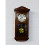 A mahogany cased wall clock the silvered dial with Arabic numerals, 76 x 35cm