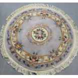 A circular floral pattern Chinese wool rug, 140cm