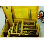 A pine tool trunk containing a selection of vintage tools to include planes, saws, screwdrivers,