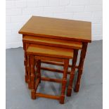 A stained wood nest of three tables, 48 x 48cm