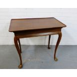 A mahogany side table raised on cabriole supports and pad feet, 68 x 78cm