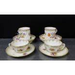 Two Dresden porcelain floral decorated coffee cans of wrythen form together with four saucers and