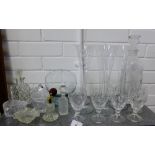 A mixed lot of cut crystal and glass to include champagne flutes, glasses, perfume bottles,