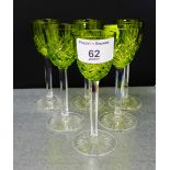 A set of six liqueur glasses, the green crystal bowl on clear facet stems, 11cm high, (6)