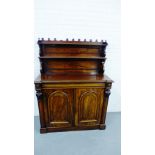 A mahogany chiffonier with shelved back over a rectangular top and pair of panelled cupboard doors