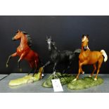 A collection of three porcelain horses to include 'My Friend Flicka', 'Black Beauty' and 'The Red