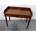 A mahogany ledgeback side table, the rectangular top with moulded edge over two short drawers,