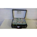 A leather cased Mahjong set