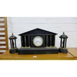 A 19th century black slate mantle clock garniture