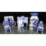 A collection of blue and white wares to include Delft porcelain miniature furniture items and a