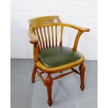 A mahogany Captain's chair, with green leather seat, raised on turned supports and stretchers, 77