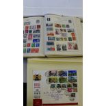 A mixed lot to include a stamp album, a small collection of postcards, together with various world