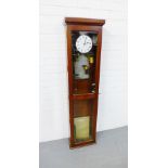 A mahogany cased Master Clock, with Roman numerals to the dial and glazed trunk doors, 140 x 35cm