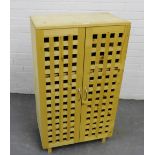 A contemporary beech wood cupboard with lattice doors, 103 x 60cm