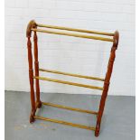 A four bar towel rail on turned end supports, 90 x 62cm