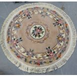 A circular floral pattern Chinese wool rug, 140cm