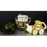 A Queen Victoria East Enders ornamental teapot, designed by Annie Rowe, together with a novelty