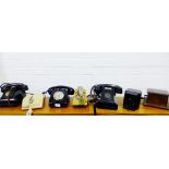 A carton containing a collection of vintage telephones, (approx 6)