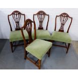 A set of four mahogany framed chairs, with pierced splats and upholstered seats, raised on