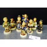 A collection of eight Hummel figures to include 'Hear Ye, Hear Ye', 'Grandma's Girl', 'Serenade', '