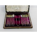 Edwardian cased set of twelve engraved silver teaspoons and sugar tongs, makers mark for Kerr and