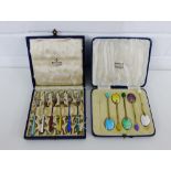 A cased set of six Danish harlequin enamel and silver pickle forks, stamped Sterling together with