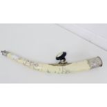 An engraved bone opium pipe with white metal mounts,