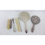 Two silver backed hand mirrors and a clothes brush together with an Epns handled comb and shoe