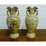 A pair of Japanese earthenware twin handled vases decorated with figures, 40cm high (2)