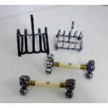 Sheffield silver miniature fire bar toast rack, a pair of Victorian ivory and Epns knife rests and