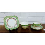 An Aynsley china floral decorated tea set comprising eight cups, ten saucers, ten side plates and