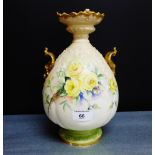 A blush ivory vase with gilded rim and handle to side, hand painted with rose spray with monogram