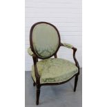 A 19th century stained beech open armchair with upholstered back arms and seat, raised on turned