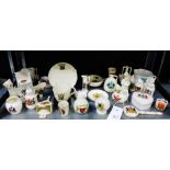 A quantity of crested china to include Arcadian china bellows, model of an old warming pan, figures,