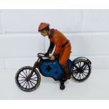 A Lehmann Echo 725 tin plate painted and lithographed motorcycle and rider, 22 x 18cm