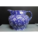 A large blue and white Burleigh Calico pattern floral jug, 24cm high
